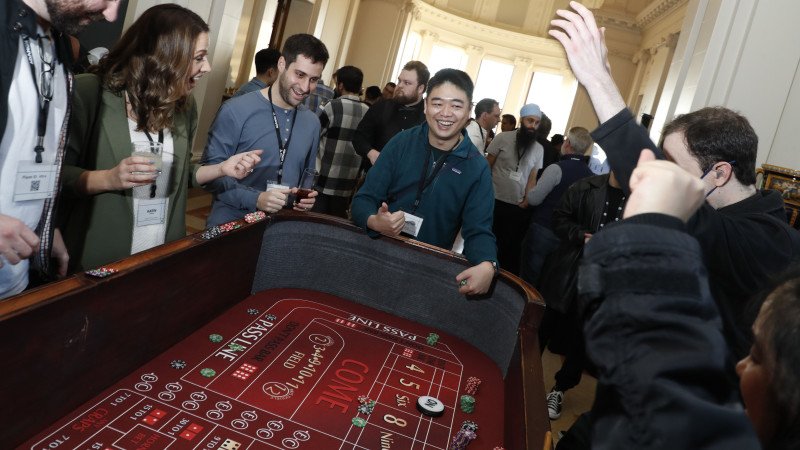 craps table players having fun at employee appreciation casino night in San Jose